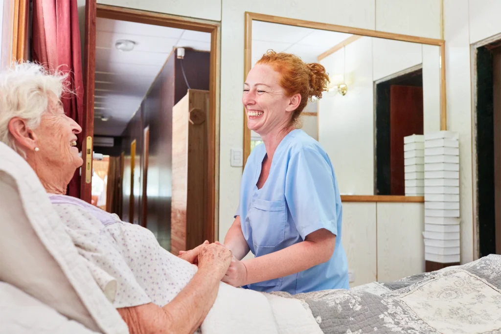 Nurse providing compassionate hospice care to an elderly patient at home, offering comfort, dignity, and emotional support