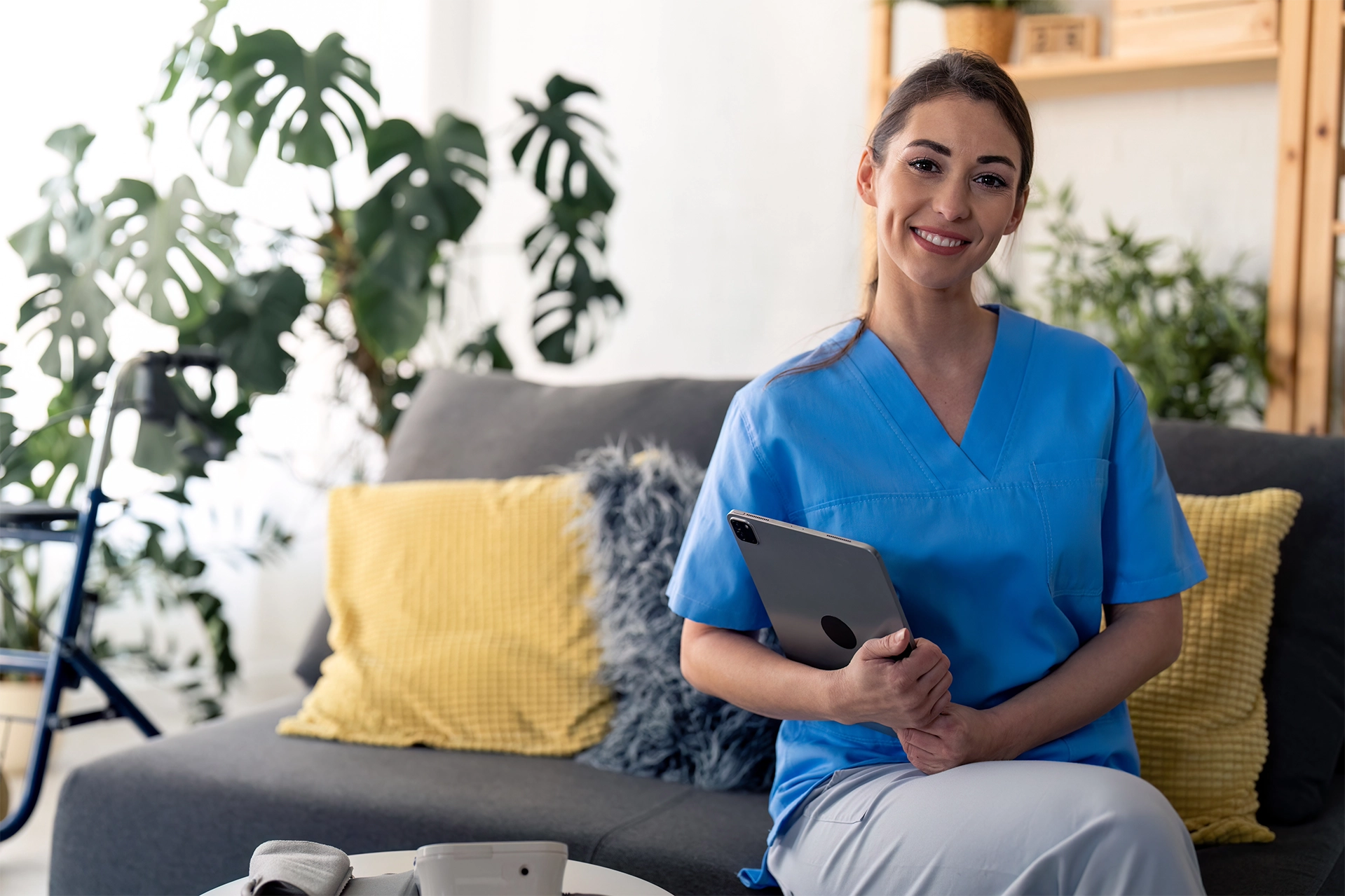Caregiver offering in-home care and companionship to a senior in a comfortable home setting, supporting independence and daily living